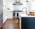 The Blanco Precis apron sink is handily placed within arm’s length of island-installed dishwasher. Kitchen Aid stainless refrigerator ties to Fisher Peykel range and hood. Milgard Tuscany windows brighten the space, making cooking and entertaining a better, brighter, more cheerful experience. Oak wood flooring grounds the space.