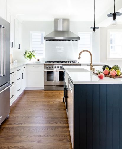 The Blanco Precis apron sink is handily placed within arm’s length of island-installed dishwasher. Kitchen Aid stainless refrigerator ties to Fisher Peykel range and hood. Milgard Tuscany windows brighten the space, making cooking and entertaining a better, brighter, more cheerful experience. Oak wood flooring grounds the space.