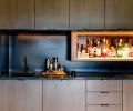 Patterson’s disappearing liquor shelf at touch of a button.