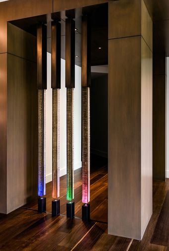 Patterson worked with artist Steve Hirt to design the custom art glass and metal room divider whose lower portion not only lights up, but also changes color.