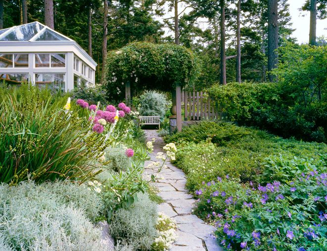 For visual contrast, custom concrete pavers line dining area. White allium volunteers amidst native kinnickinnick ground cover.