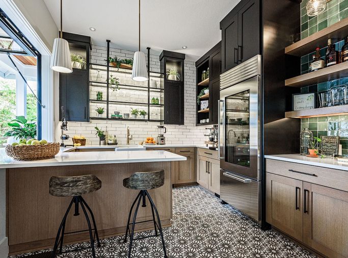 Entertaining center/juice bar’s handsome black cabinets joined by custom metal fabricated glass shelves; Bedrosian Remy floor tile ties to Z Collection Stow Olive mix backsplash tile. Rift cut oak-stained cabinetry; Emtek black pulls.