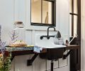 Rejuvenation outdoor sink flanked by madrone wood shelves alongside the she shed Dutch door.