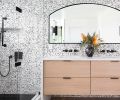 In other areas of the home, the black-and-white color scheme was carried into a master bath and a powder room.