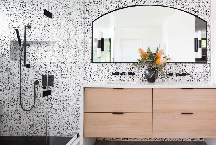 In other areas of the home, the black-and-white color scheme was carried into a master bath and a powder room.