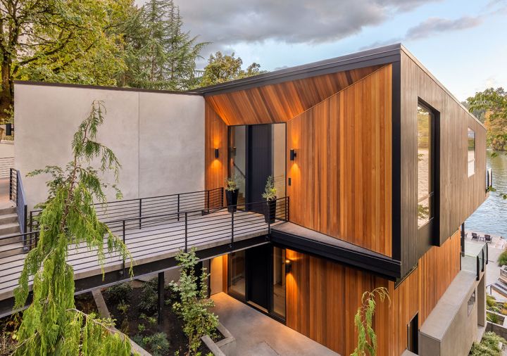 Complex steel bridge with concrete cap adds curb appeal, drawing eye to red cedar trimmed entry, Portland Millwork Kolbe door. Black stained vertical cedar frames Kolbe window.