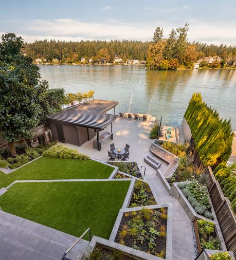 Height of home provides landscape view with transitioning levels to new boat house.