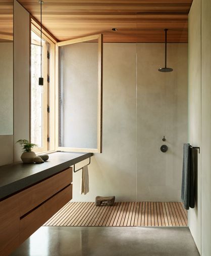 The main en-suite is a soothing retreat with plaster walls, black granite counters and teak cabinetry.