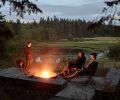 The firepit at the edge of the meadow overlooks the pond and is a natural place for family to gather