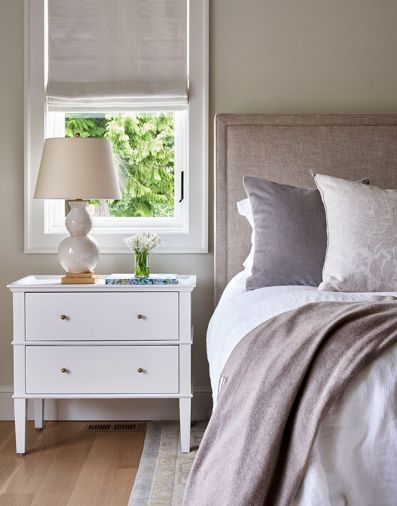 Neutral colors and soft whites grace bedrooms and bathrooms. Lee Industries headboard from J Garner Home.