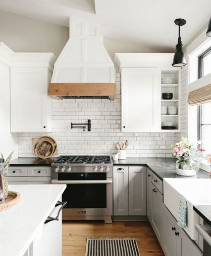 Miele range and exhaust with Fuller Woodcraft custom hood. A second dishwasher by Miele makes cleanup easy.