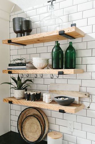 Wooden shelves mounted on 2x6 locking add contrast to Dal Rittenhouse Alpine White tile with Tec Powergrout in Raven.