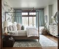 Auberge poster bed with metal canopy set against Phillip Jeffries wallpaper mimics soothing mountain range. Custom Belgian textured Linen 2-fold French-Pleat drapery in Spruce frames view. Slocum Hall side tables echo wood windows and doors.