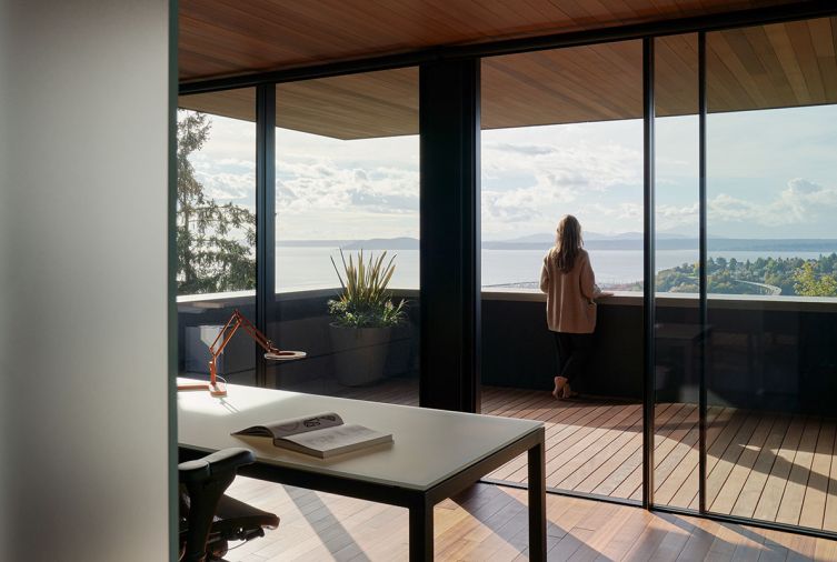 Office with covered sleeping porch. Room & Board custom Parsons desk with white glass faces West.