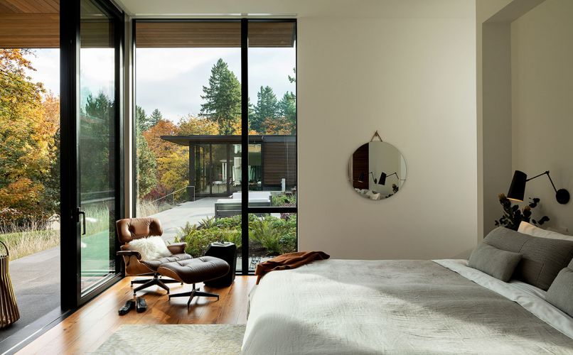 ‘Newbridge’ Flexform bed - headboard folds up/down. Eames chair looks toward spa and gym beyond. Mateo linens. DuChateau “Vernal American Walnut” flooring.