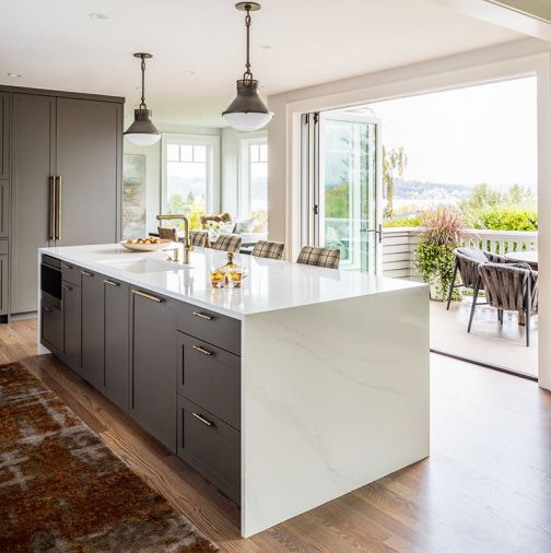 The banquet nook features custom upholstery cushions covered in a durable anti-stain and anti-fade Perennials fabric sourced through the Susan Mills Showroom at the Seattle Design Center.