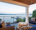 The covered porch was rebuilt and the owners enjoy the views in Restoration Hardware furniture.