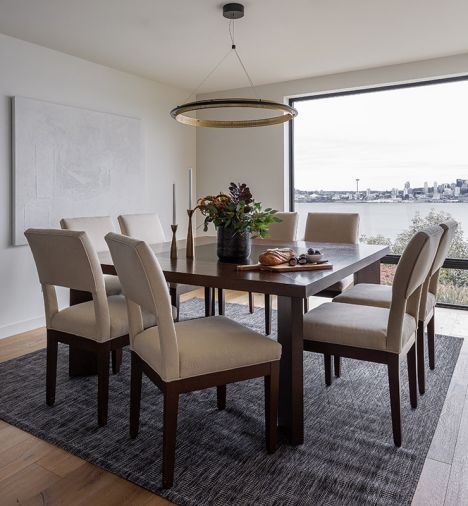 West Elm chandelier crowns existing dining furniture overlooking Elliott Bay.