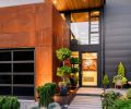 Williams’ use of horizontal garage glass echoes Marvin Contemporary windows’ placement and is reiterated in staircase tower’s glass orientation. Japanese Holly Sky Pencil pops against Corten steel garage.