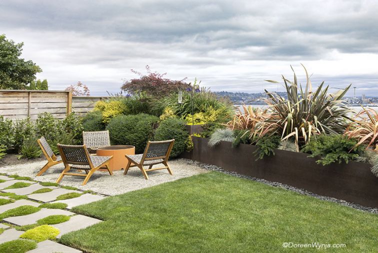 New Zealand Flax, Blue Fescue, and Lithodora Grace Ward fill steel planter. Scotch Moss adorns pavers.  Photography © Doreen L. Wynja