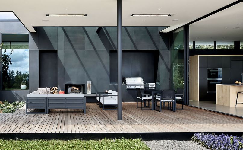 he blackened steel casework in the outdoor room is a collaboration between Scott Edwards Architecture and iBuildPdx. Skylights wash sunlight down its front. Photography © Jeremy Bittermann/JBSA