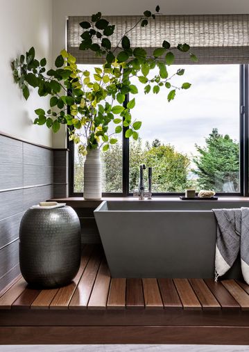 In the primary bathroom, a Hydro Systems tub from Seattle Interiors was placed on a custom Ipe platform.