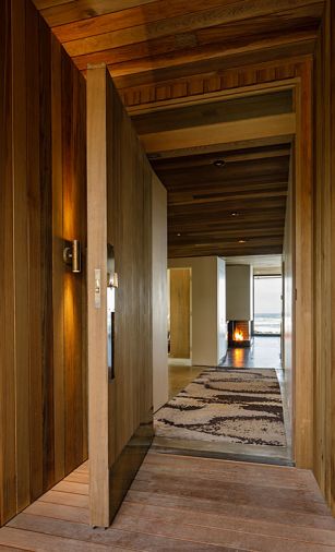 The cedar and brass front door was crafted by Portland studio Quartertwenty.