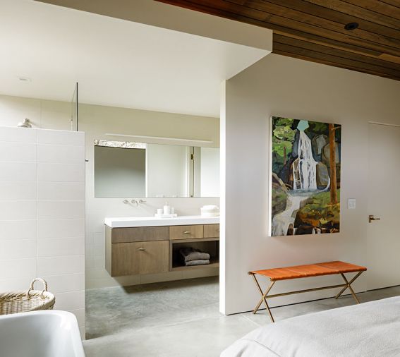 The primary bathroom flows into the bedroom.