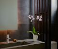 Powder room features a custom sink by Cement Elegance of Bend, Oregon. Milano Faucet by Fantini sourced from Chown Hardware.