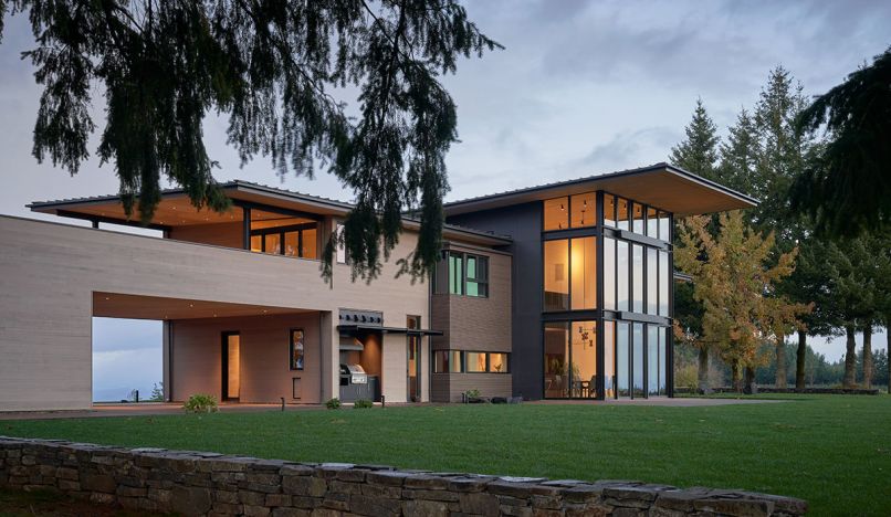 Dramatic dining windows by Western Window Systems ribbed with Newberg Steel exposed structural steel. Metal roofing with stained plywood soffit panels. UDS Steel canopy over Lynx Grills BBQ grill. Horizontal stained cedar siding from Parr Lumber. Cembrit fiber cement boards by Facades Northwest. Structural engineering by Seattle’s Bykonen Carter Quinn.