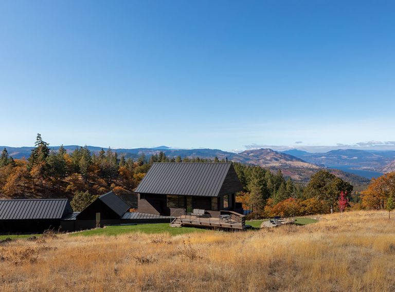 To adhere to the height restrictions, Telford + Brown dug into a bench on the hillside creating a linear, topically correct architectural design that opens every room to spectacular views of the Gorge, ranging from Mt. Adams to the north and Mt. Hood to the south. Easy Lock Standing Seam metal roofs in Charcoal from Taylor Metal in Salem, OR. Nakamoto Forestry charred Shou Sugi Ban Gendai Alkyd Oil Black siding.