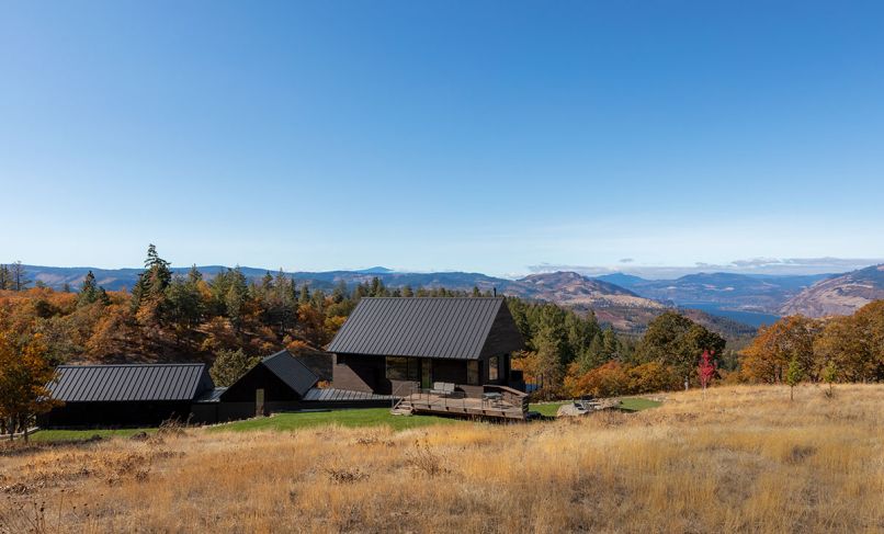 To adhere to the height restrictions, Telford + Brown dug into a bench on the hillside creating a linear, topically correct architectural design that opens every room to spectacular views of the Gorge, ranging from Mt. Adams to the north and Mt. Hood to the south. Easy Lock Standing Seam metal roofs in Charcoal from Taylor Metal in Salem, OR. Nakamoto Forestry charred Shou Sugi Ban Gendai Alkyd Oil Black siding.