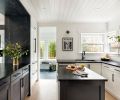 Various remodels over time created inconsistency in ceiling height and type. Pavilion lifted the kitchen ceiling to match, adding necessary volume to the small space. “Ceilings are often overlooked, but they are such a big part of the room,” said James. “The shiplap texture in white is modern and casual.” The original cabinets were kept and treated with updated hardware.