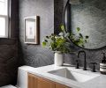 Small spaces offer the opportunity to get playful with style. “Powder rooms are one of my favorite rooms to work with,” said James. “You can have fun and make a big impact.” Boldly expanding on the homeowners’ love for the ocean, the “Eijffinger” wallpaper undulates in moody waves.