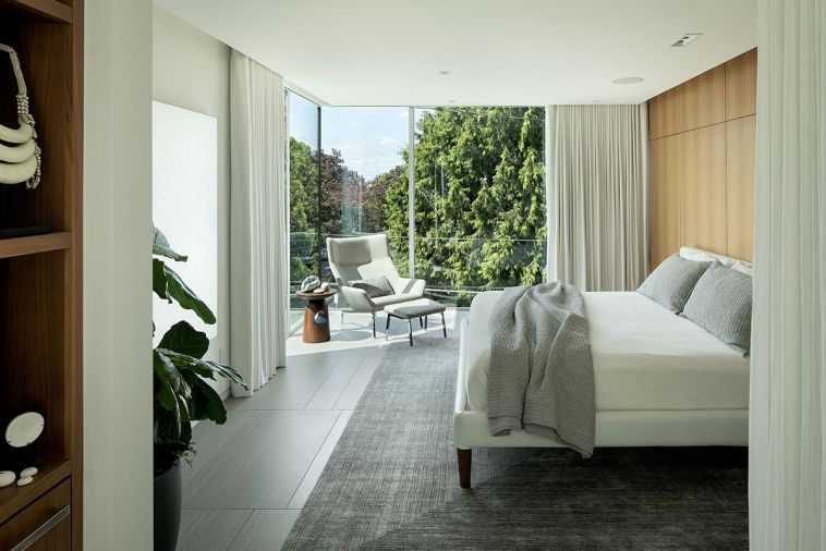 Primary Bedroom with Parallel Bed, designed by Jeffrey Bernett, Nicholas Dodziuk for Design Within Reach. Hidden closet in wall now houses workout room. Park lounge chair and ottoman by Niels Bendtsen, from Bendtsen.