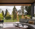 The third-floor terrace has outdoor kitchen components. The green roof melds into the park view, and steel work is by Gagnon Steel.