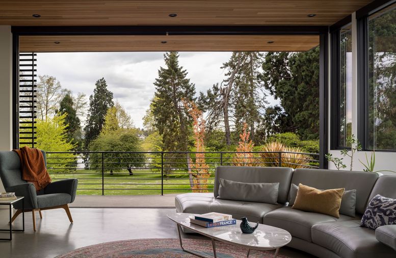 The third-floor terrace has outdoor kitchen components. The green roof melds into the park view, and steel work is by Gagnon Steel.