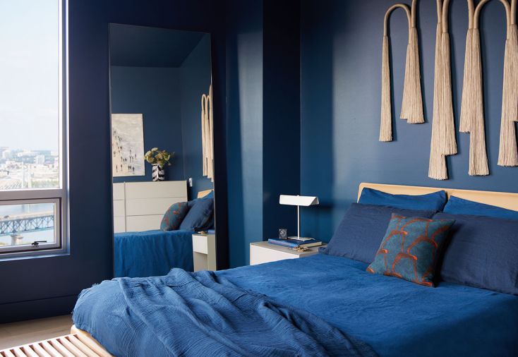 A coat of Benjamin Moore’s Gentleman’s Gray promotes relaxation in the bedroom.