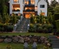 Bender Wasenmiller’s three-story design glows from floor-to-ceiling Sierra Pacific bedroom windows with unobstructed views. Pleated hornbeam trees define one of four terraced gardens, bluestone pavers and Tolfino Blue K2 stone walls.