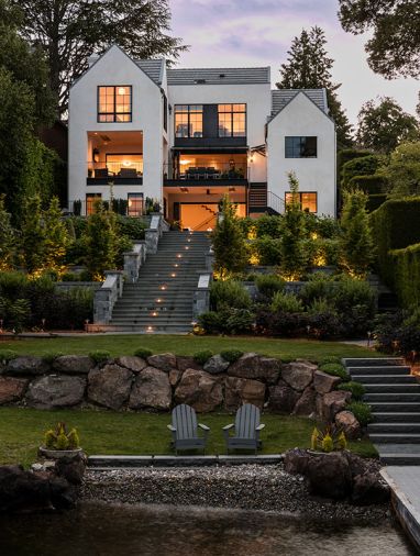 Bender Wasenmiller’s three-story design glows from floor-to-ceiling Sierra Pacific bedroom windows with unobstructed views. Pleated hornbeam trees define one of four terraced gardens, bluestone pavers and Tolfino Blue K2 stone walls.