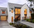 Concrete Florida rooftile and gutters counter stonewalled staircase to main entrance. Tandem parking available in adjacent driveway.