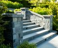 Handsome staircase features bluestone pavers and K2 Stone walls.