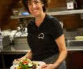 Executive Chef Annie Cuggino at work in her open kitchen enjoys engaging with her guests about the fine elements of her cuisine.