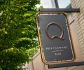The “Q” logo welcomes guests on SW 2nd Avenue.
