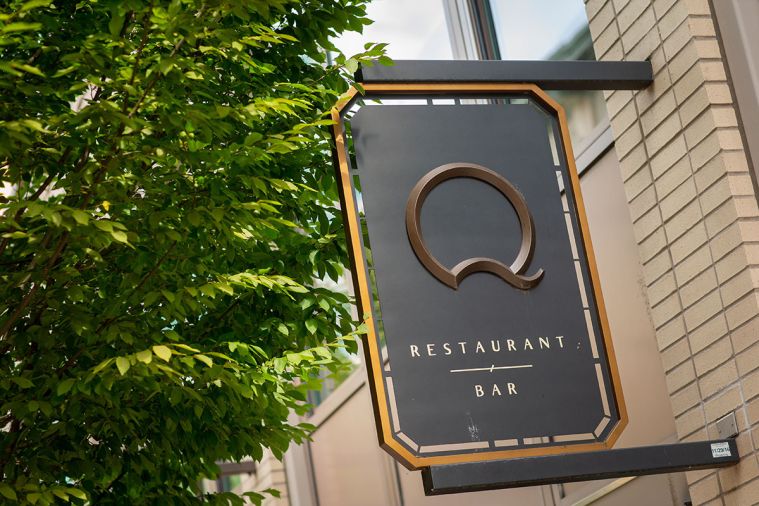The “Q” logo welcomes guests on SW 2nd Avenue.