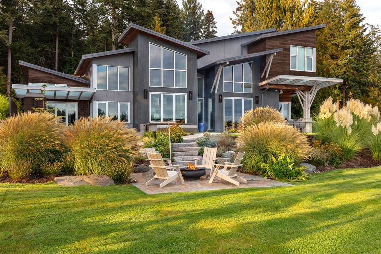 S9 Architecture and AM Interior Design recently completed this Gig Harbor home infused with nature. Exterior finishes include Porcelanosa Age Dark Nature tile and Americana Bingaman Thermally Modified Poplar siding.