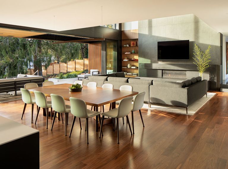 This new home in Portland revolves around its well-appointed great room, where a 30-foot stacking glass door opens to an outdoor room and the backyard. “The challenge was to create grand spaces that could be intimate for groups of people,” says designer Rick Berry of Scott Edwards Architecture. The engineered Walnut hardwood flooring is by the Graf Brothers.