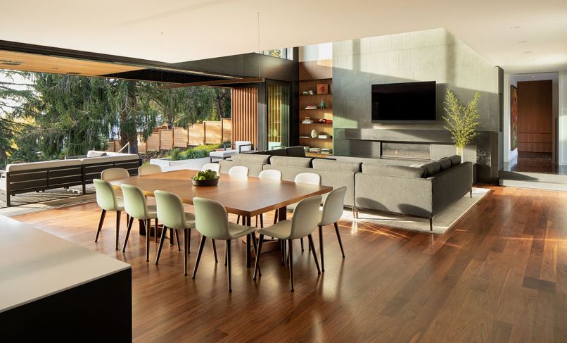 This new home in Portland revolves around its well-appointed great room, where a 30-foot stacking glass door opens to an outdoor room and the backyard. “The challenge was to create grand spaces that could be intimate for groups of people,” says designer Rick Berry of Scott Edwards Architecture. The engineered Walnut hardwood flooring is by the Graf Brothers.