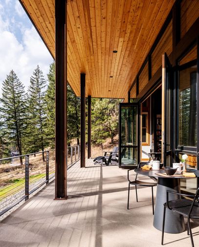 On the view side, the NanaWall opens to a covered veranda for soaking up the sun when it’s not too windy. The underside of the eaves are covered in Douglas Fir Shiplap Chanel siding, which is carried inside for continuity, and provided by North Valley Lumber. The site-built custom railings are from Johnsen Steel Works.