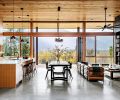 A NanaWall System and Sierra Pacific Windows from North Valley Lumber frame the beautiful views and open to the covered veranda. Kitchen barstools from Hay offer easy conversation during meal prep. Kirkham Tufted leather stools from Pottery Barn in the living space can be utilized for a chat around the fire or easily adjusted to enjoy the scenery.